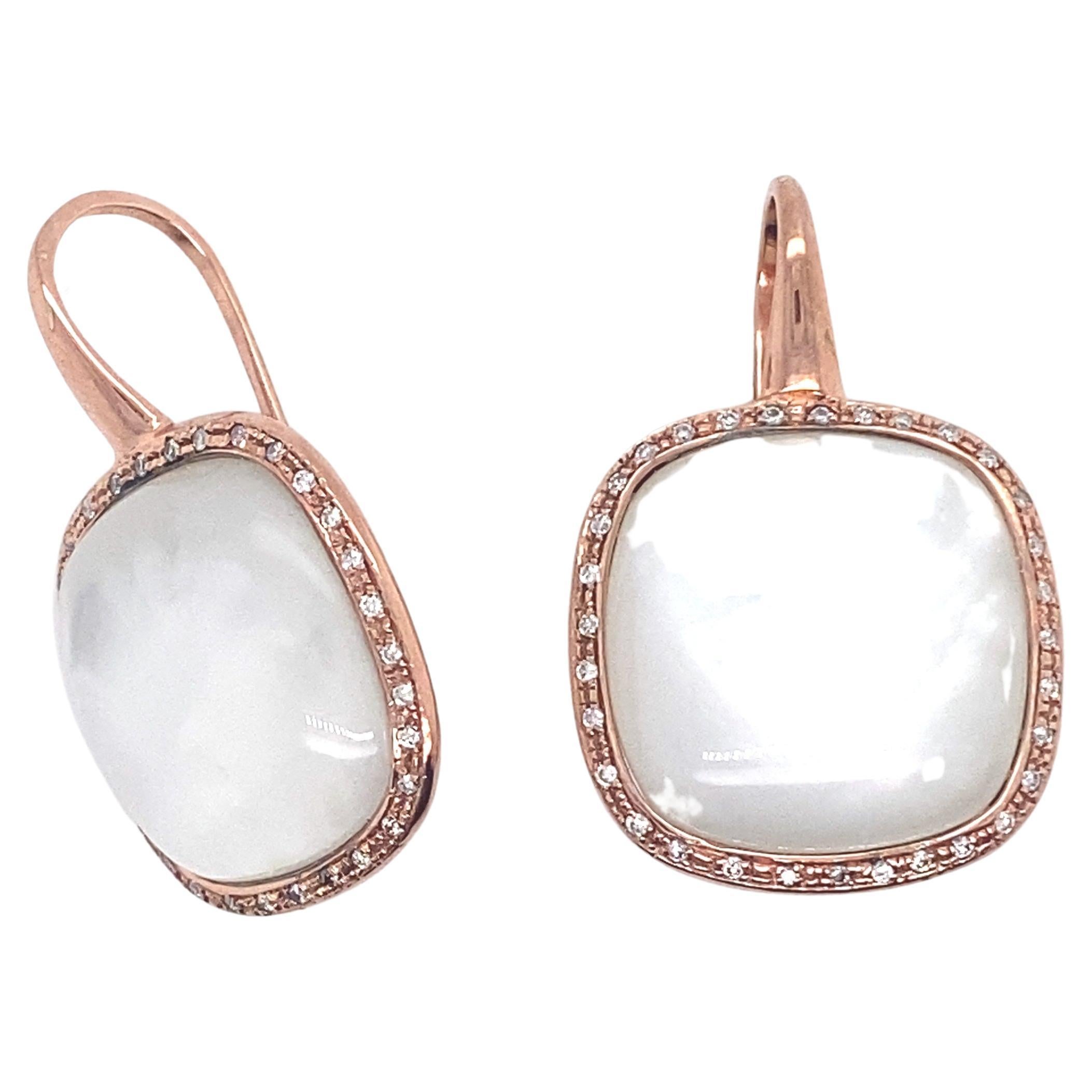 Welcome to our showcase page, where we're delighted to present this stunning pair of 18-carat rose gold earrings, adorned with a magnificent white quartz surrounded by diamonds, an elegant combination of softness and sparkle.

These 18-carat rose