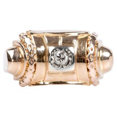 Bague en or rose 18 carats ornée d'un diamant brillant de 0,032 carat de taille ronde.