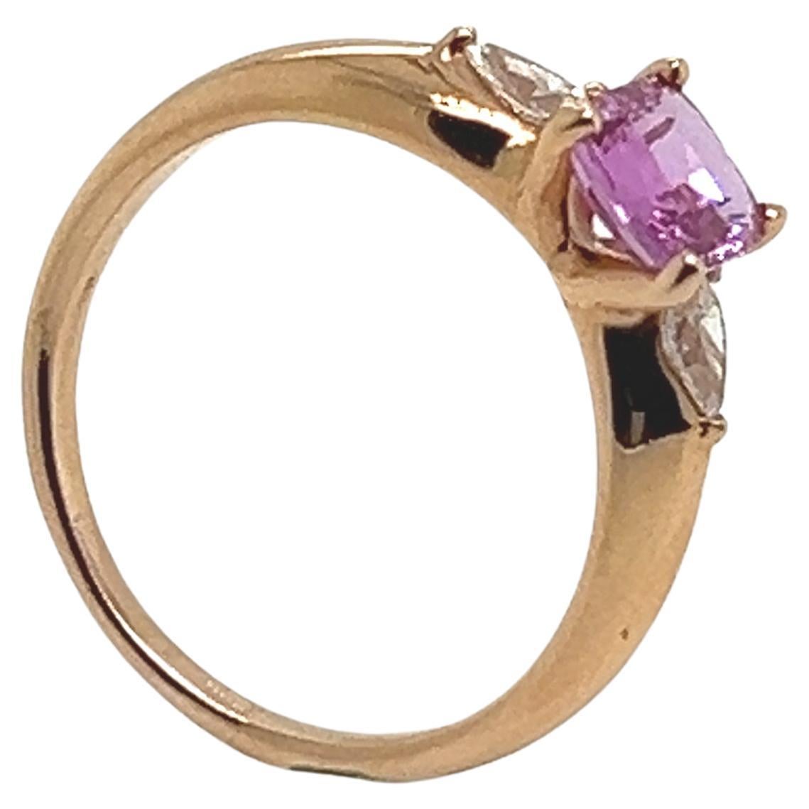 18-Carat Pink Gold Ring with Pink Sapphire and Two Diamonds Totaling 1.07 Carat