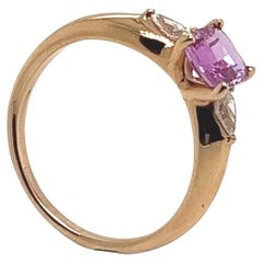 18-Carat Pink Gold Ring with Pink Sapphire and Two Diamonds Totaling 1.07 Carat