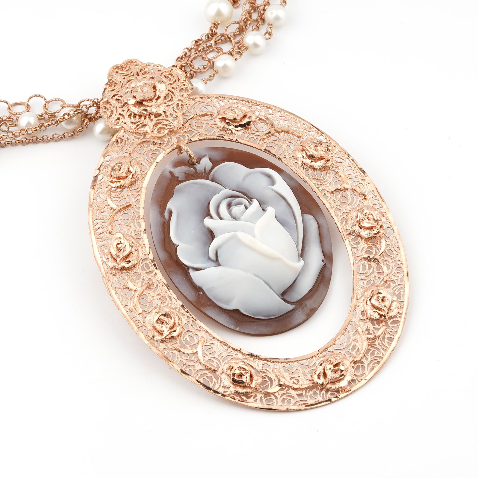 18Kt Rose Gold Plated 925 Sterling Silver Sea Shell 45mm Cameo Necklace 95cm. Fully handcarved Rose on a sea shell cameo set in a 18kt Rose Gold plated silver pendant necklace with black onyx. Carvings are performed by our master artisans with