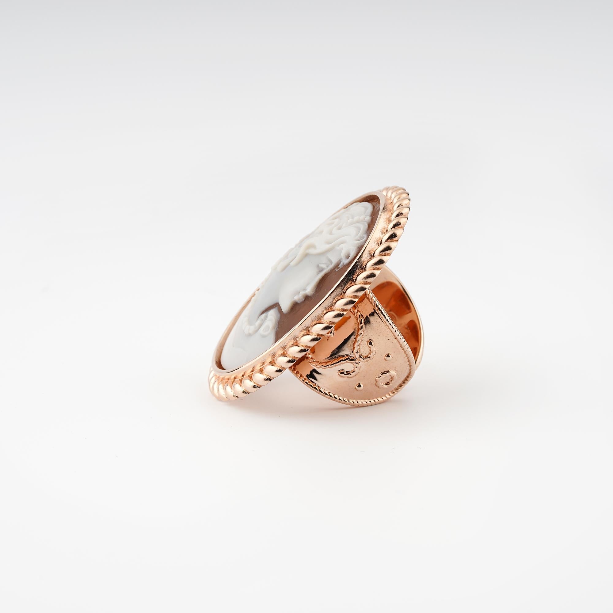 18 carat Rose Gold Plated 925 Sterling Silver with 38mm Sea Shell Cameo adjustable ring. Fully handcarved Portrait on a sea shell cameo set in a 18kt Rose Gold plated silver adjustable shank ring. Carvings are performed by our master artisans with