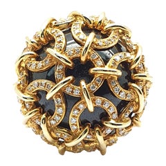 18 Carat Rose Gold Ring with Onyx held by Rings Occupied with Diamonds