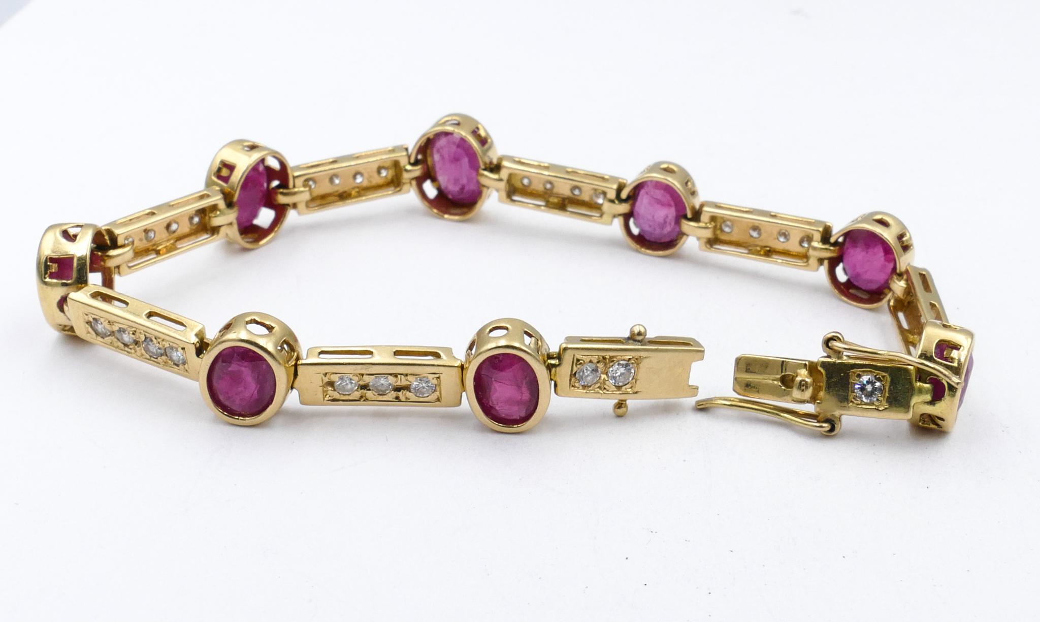 8 Good Rubies are the Centrepiece of this very wearable 'goes with everything' Bracelet. 
The Rubies are Oval Cut, purplish-red in colour, individually bezel set along with 29 round brilliant cut Diamonds, colour G/H, clarity SI1-SI2, & 0.87 Carats.