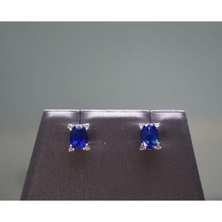 Sapphire Weight: 1.8 CT, Measurements: 7x5 mm, Diamond Weight: 0.06 CT 1.2 mm, Metal: 18K White Gold, Gold Weight: 1.84 gm, Shape: Oval, Color: Blue, Hardness: 9, Birthstone: September