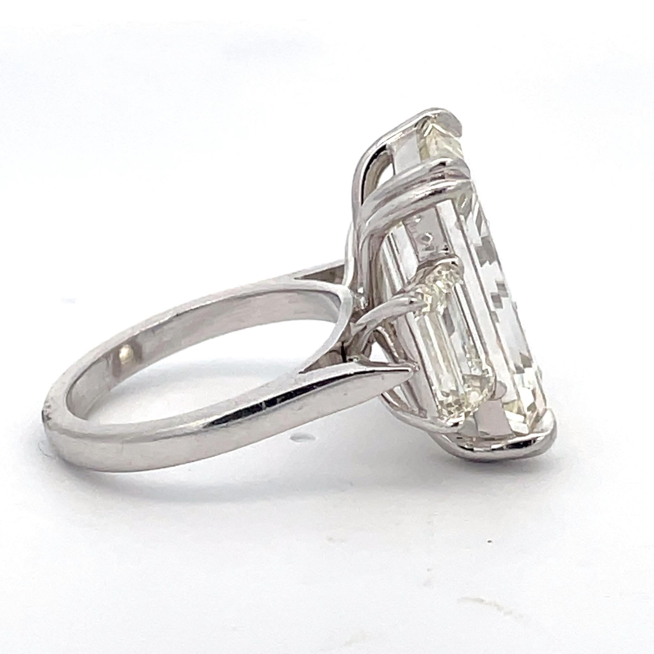 Emerald Cut 18 carat three stone engagement ring For Sale