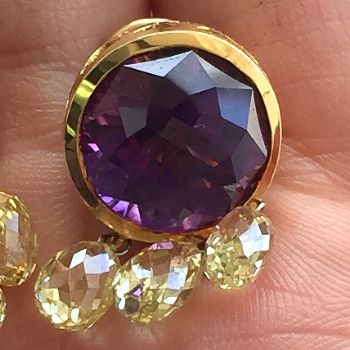 18 Carat Tw Amethyst and Yellow Diamond Briolettes Earrings, Diamond Briolettes of this size are very expensive and hard to get.


Amethyst Details:
Number of stones: 2
Carat Weight: 11.70 
Shape: Round
Color: Purple
Clarity: Super Clean No Visible