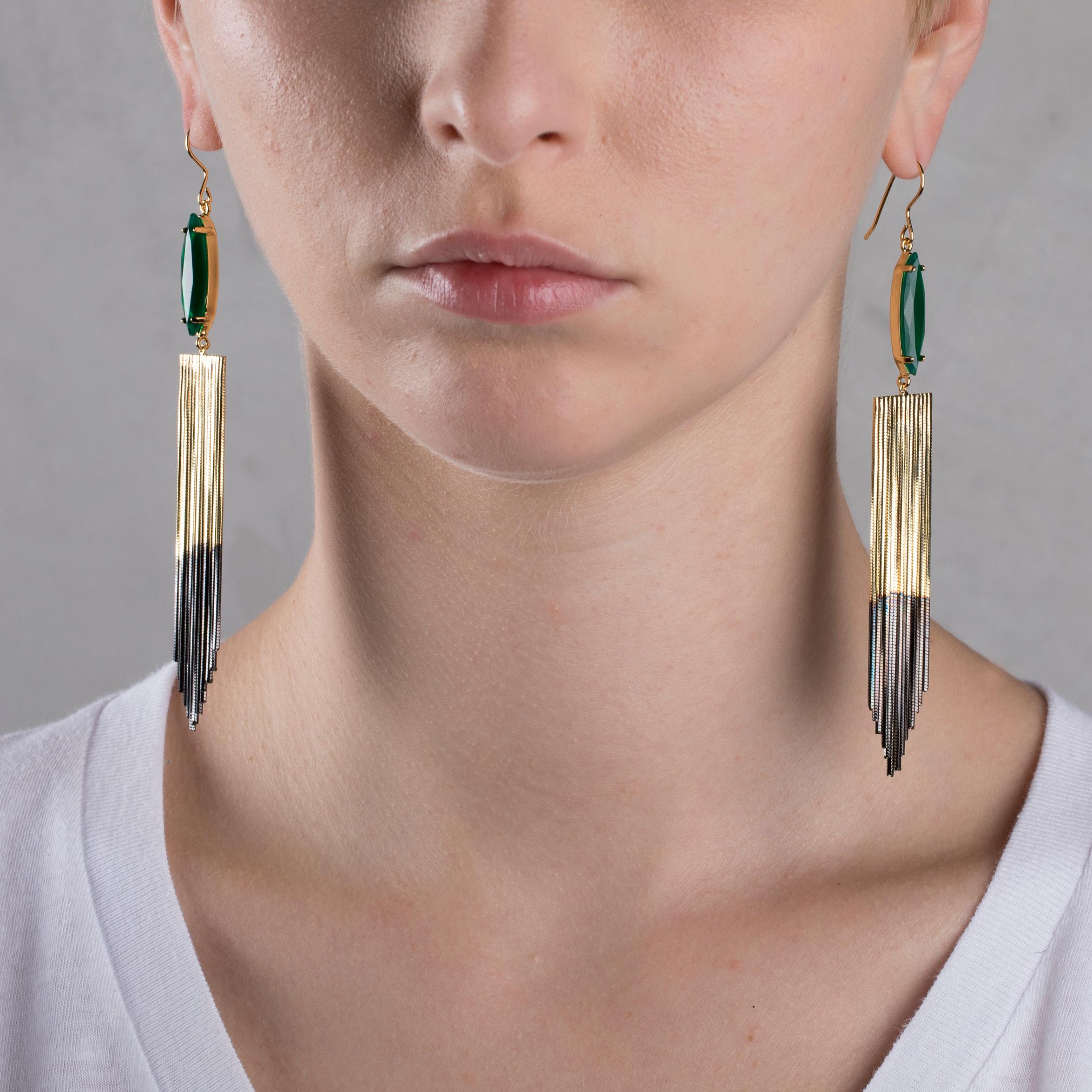 Wear timeless elegance through this pair of earrings from Iosselliani. Beautifully designed in Italy from Iosselliani,these brass earrings are adorned with a triangular cut soft fringe cascade, plated in the two tones colors, 18K gold plated and