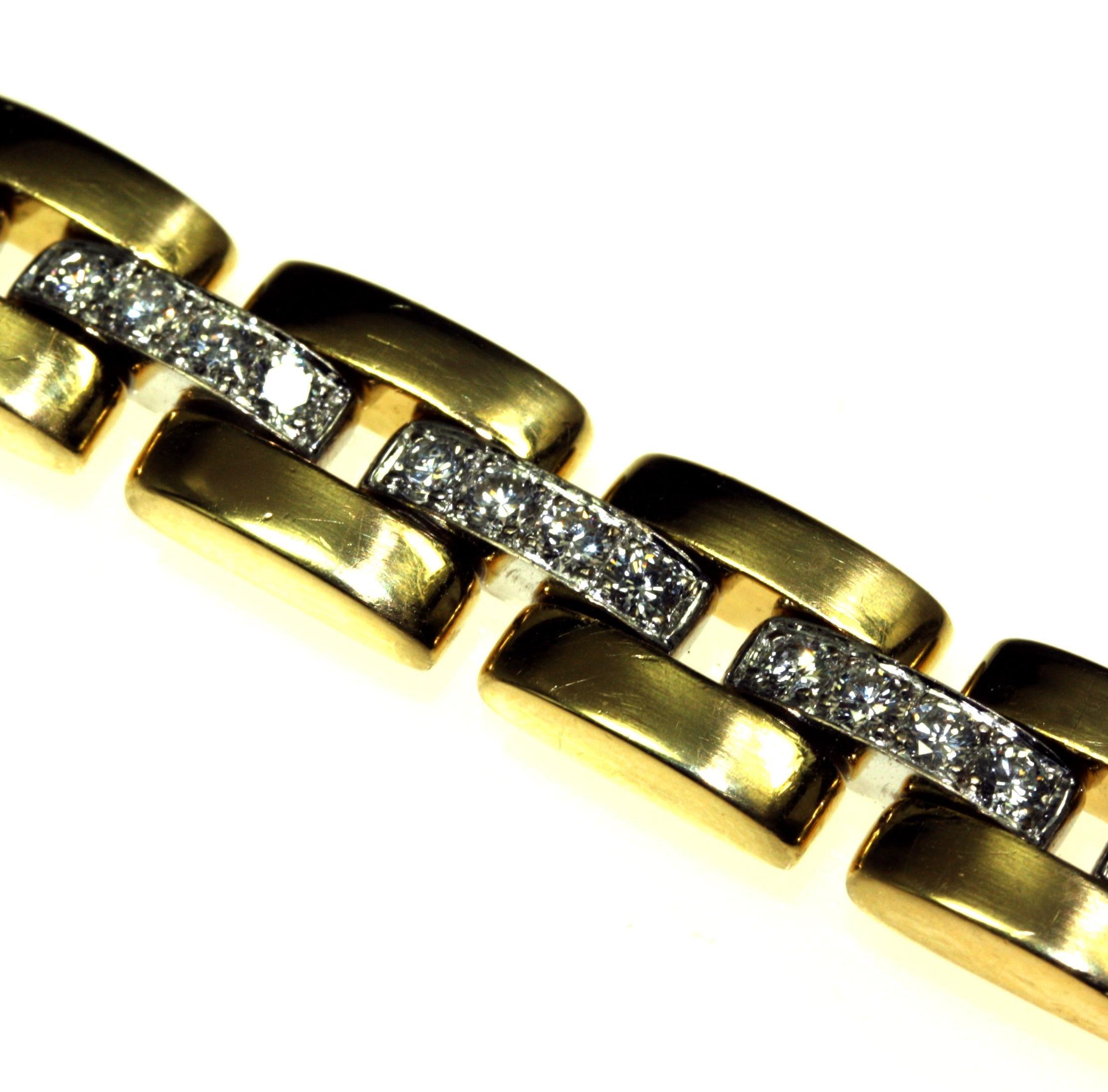 The bracelet 18ctwhite and yellow gold, comprising a row of fifteen diamond set bar links in white gold, between two rows of yellow gold bar links. Four brilliant cut diamonds are grain set in each of the white gold bars. The diamonds are .06ct