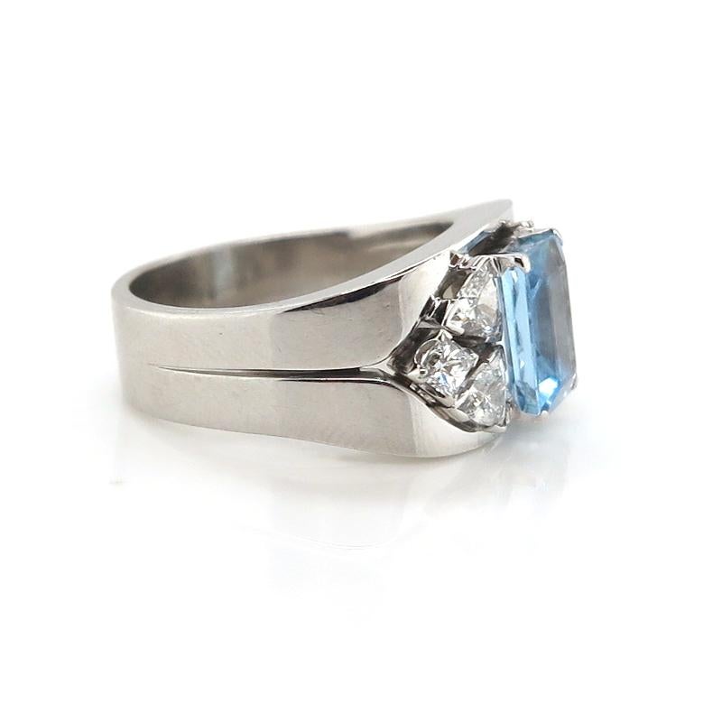 18 carat White Gold Aquamarine Ring takes you back to the 1970s showcasing elegance with bright trillion-cut and princess-cut diamonds adorning this spectacular ring. 


