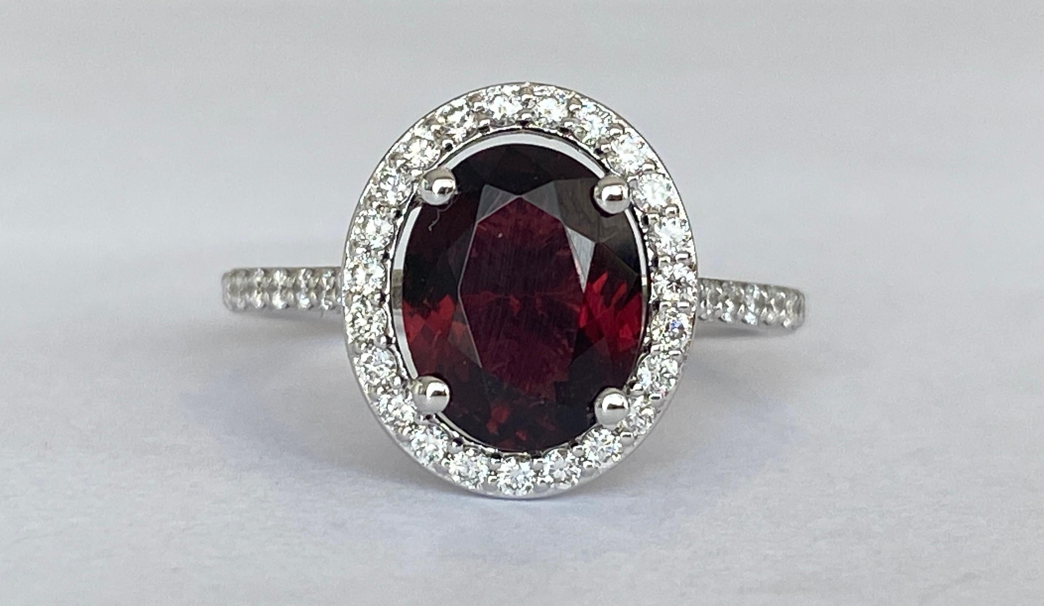 Offered beautiful Diana ring in white gold, with a beautiful oval cut Red tourmaline 1.90 ct. The ring is decorated with 37 pieces of brilliant cut  diamonds, 0.35 ct in total, of quality F/G/VS/SI. ALGT certificate is included. Report