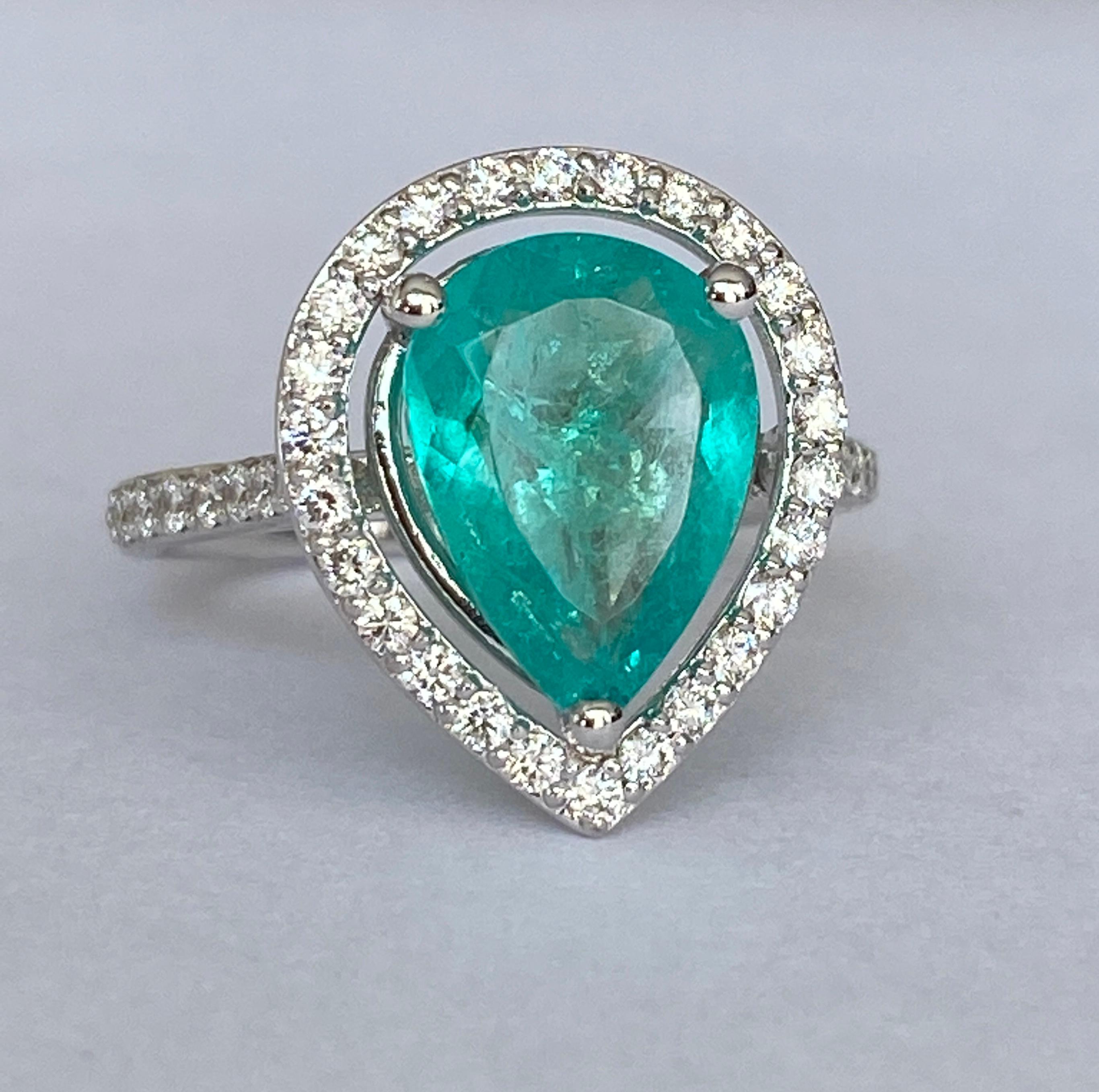 Offered in new  condition, Cocktail ring in white gold, with an pear mixed cut emerald  of 2.30 ct. The stone is surrounded by an entourage of 40  pieces of brilliant cut diamonds, approx. 0.48 ct in total, of quality F/G/VS/SI. ALGT certificate is