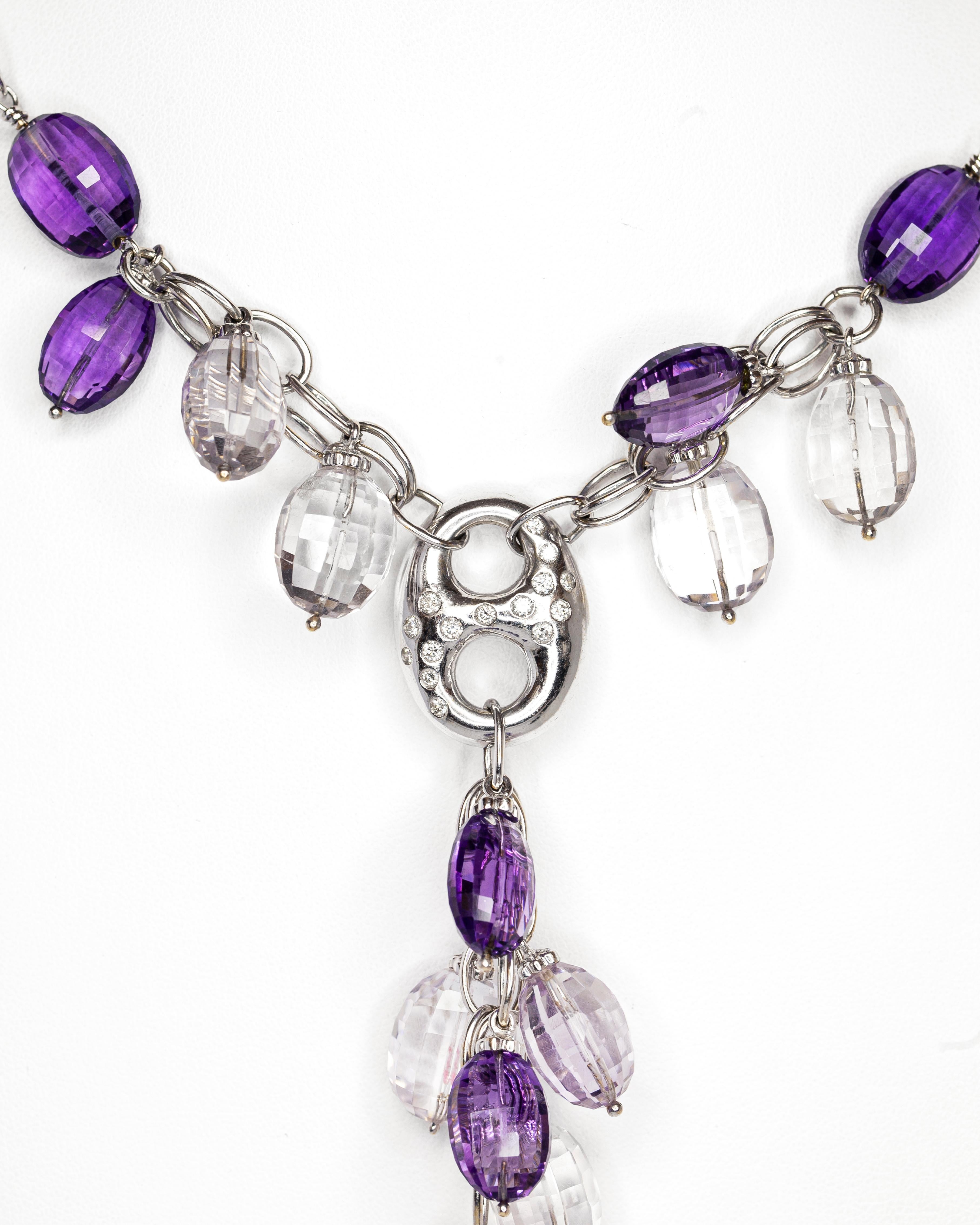 This incredible 1960s style necklace boasts 17 purple amethyst and colourless briolettes (cut beads) which cascade into a stunning drop. This piece is accentuated with a beautiful diamond- set pendant. The dangling briolettes are also embellished