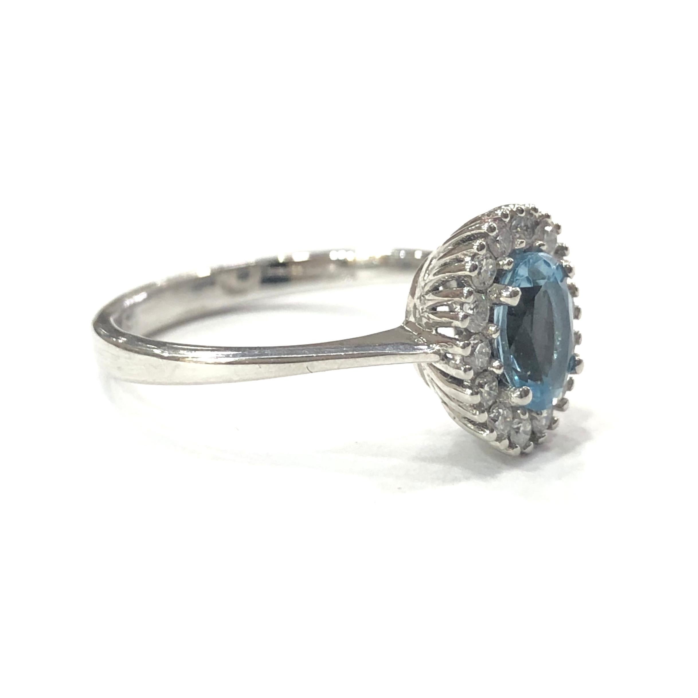 18ct White Gold Aquamarine and Diamond Cluster Ring. Set with a central oval Aquamarine set in a four claw setting, surrounded by 14 round brilliant cut Diamonds.
With a full english hallmark.

Approximate Aquamarine weight : 0.75ct
Approximate