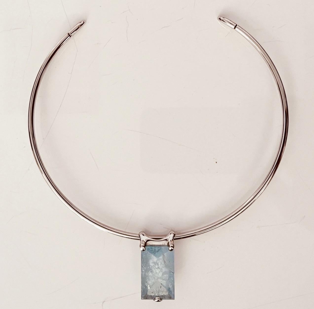18 carat white gold choker with rectangular Aquamarine removable pendant. 12cm choker diameter, 6.8cm opening.    This necklace falls under two categories: choker and pendant necklaces. The Aquamarine pendant measuring 25x11x9mm. Hallmarks: signed