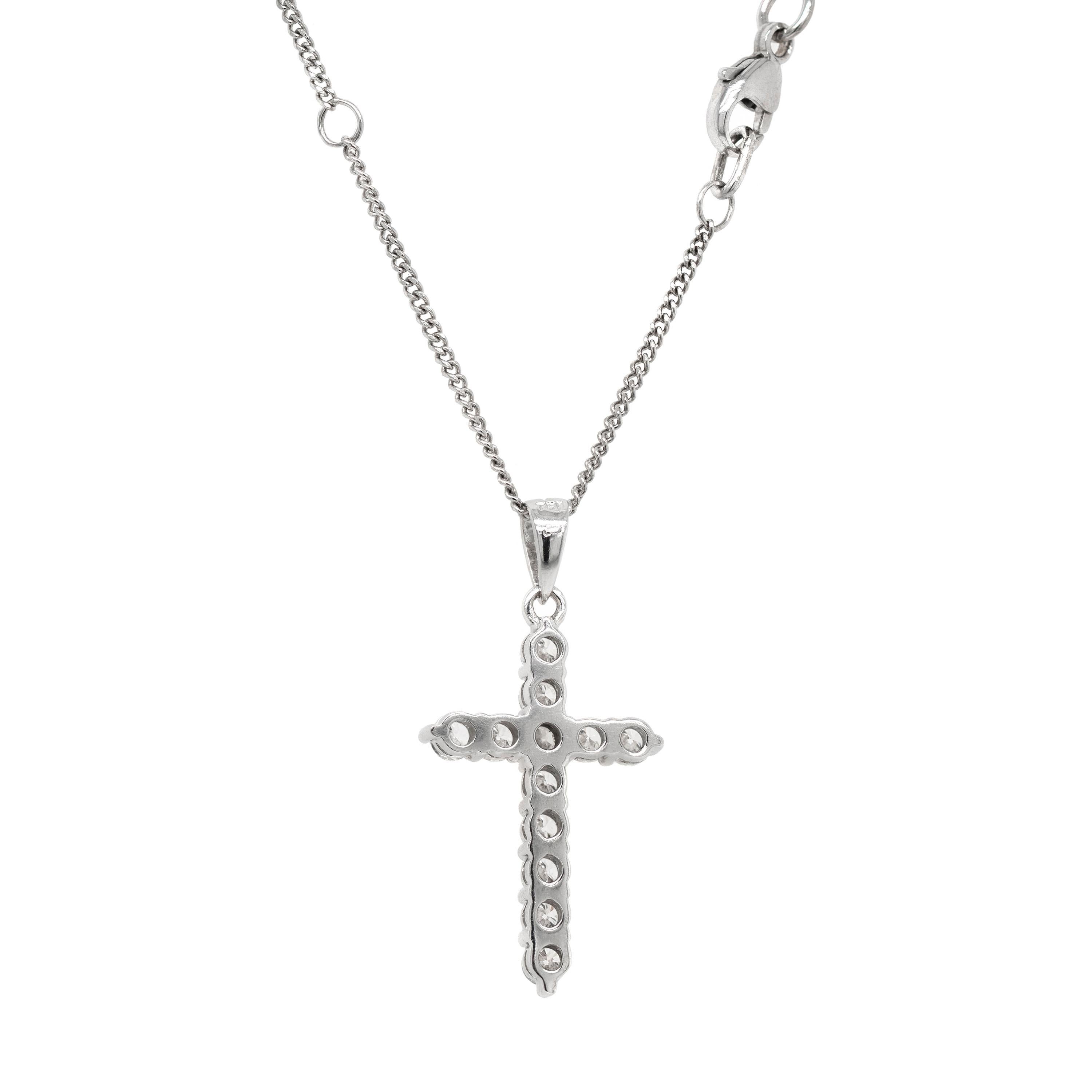 This beautiful classic cross pendant features 12 round brilliant cut diamonds with a total combined weight of 0.87ct, all mounted in claw, open back settings. The pendant hangs from a fine 18 carat white gold 16