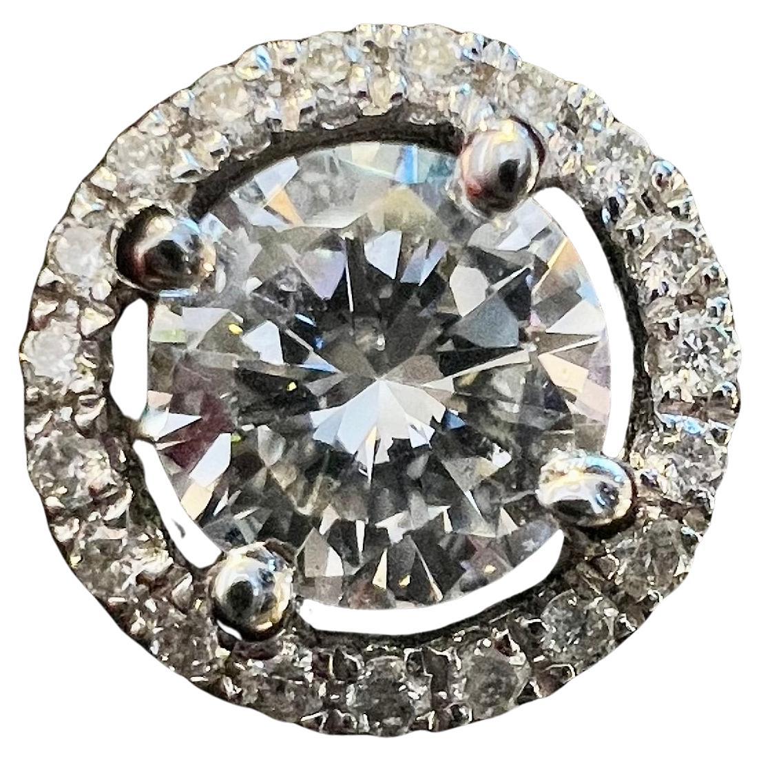 Superb pair of 18 carat white gold earrings

Set with two modern-cut diamonds For twice 0.50 carats each or 1 carat in total for the two diamonds
Estimated by H color care, Vs2 purity

Surrounded by a paving of brilliants for About 0.15 carats in