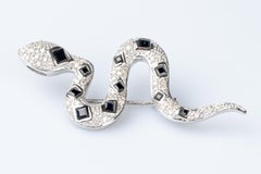 18 carat white gold diamonds and sapphires snake brooch