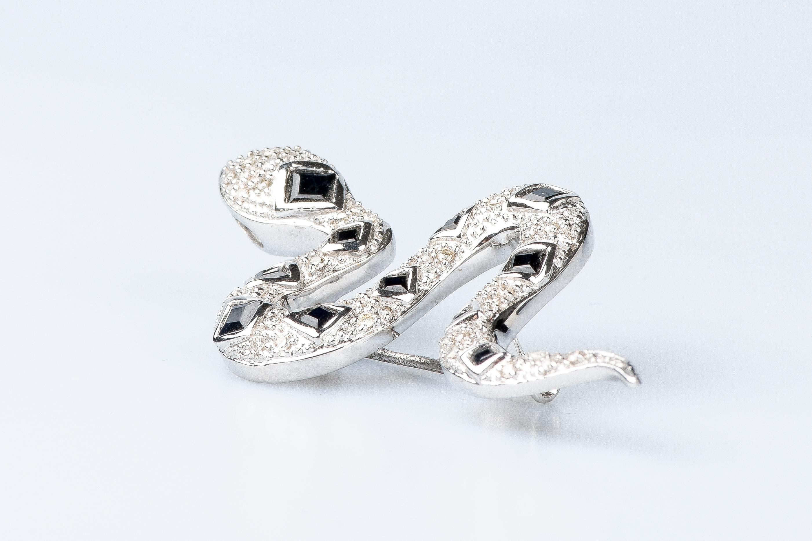 Women's or Men's 18 carat white gold diamonds and sapphires snake brooch For Sale