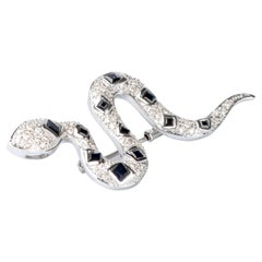 18 carat white gold diamonds and sapphires snake brooch