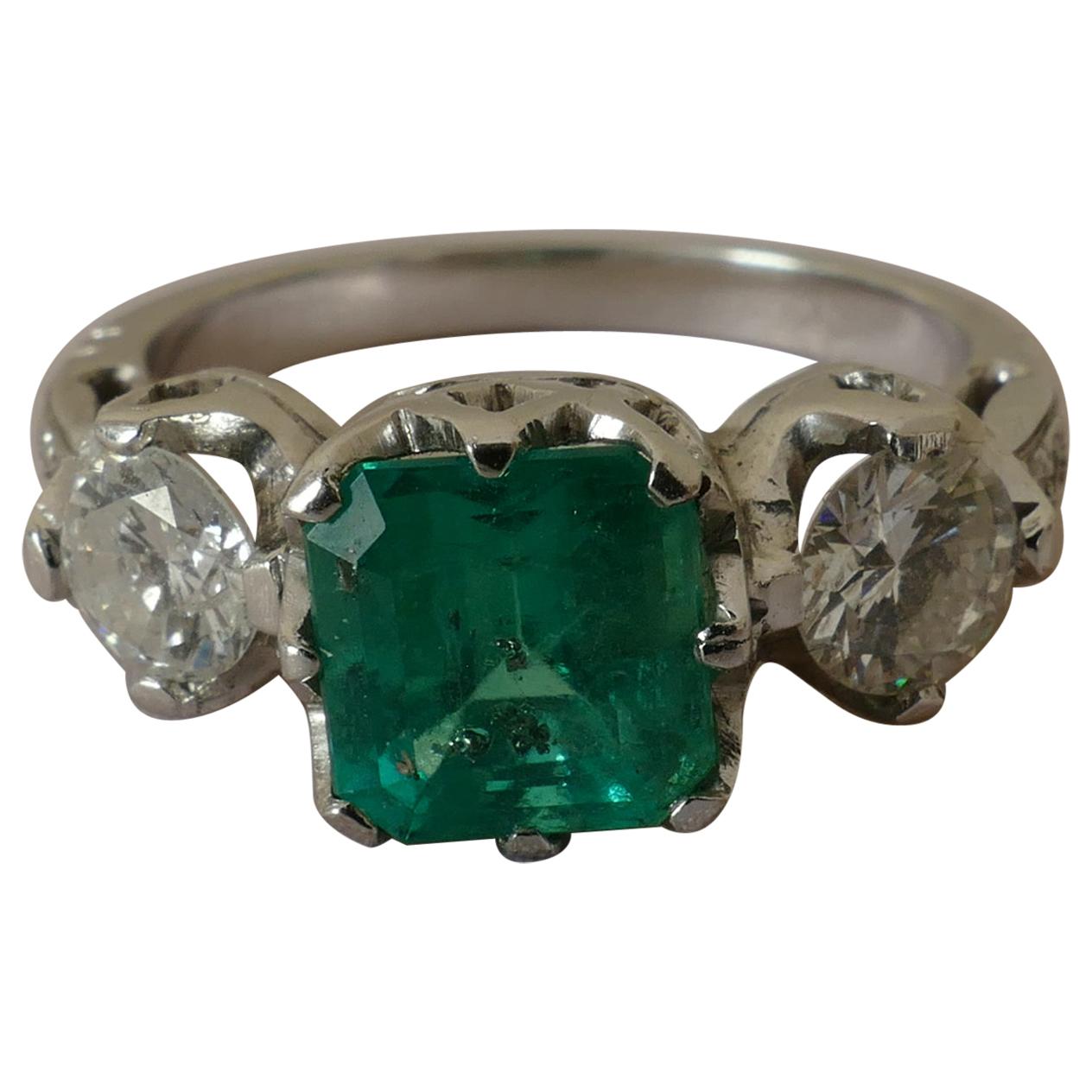 18 Carat White Gold Emerald and Diamond 3-Stone Ring