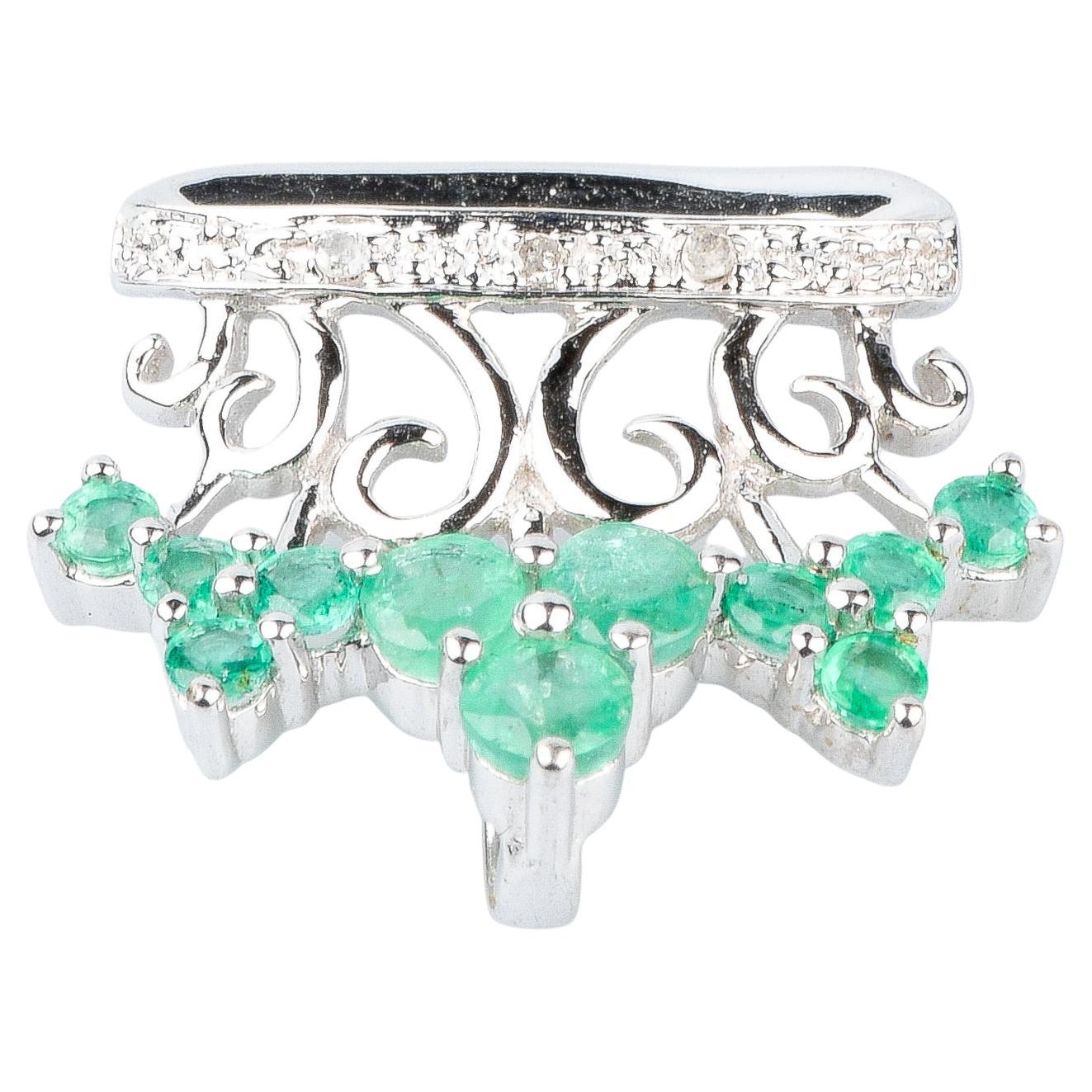 18 carat white gold emeralds and diamonds pendant