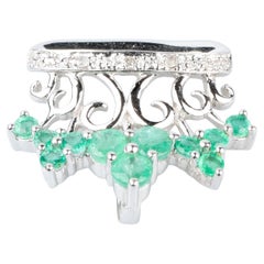 18 carat white gold emeralds and diamonds pendant
