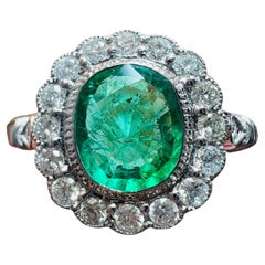 18-Carat White Gold Engagement Ring Emerald Surrounded with Diamonds