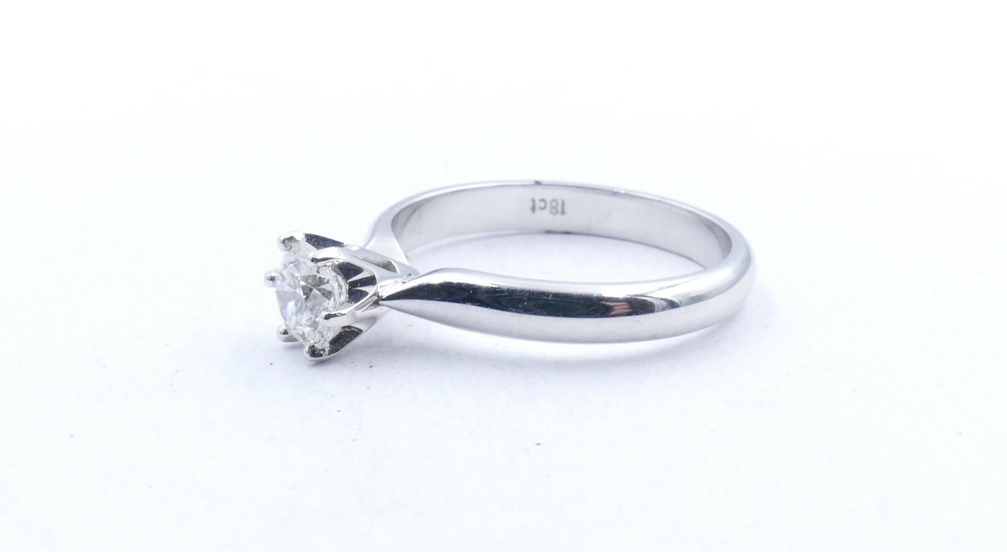 The Colour of this classically elegant Ring, F, is the real standout.
Beautifully crafted in 18ct white gold it is SI1 clarity with a GIA Report Number 2165315679 inscribed on the girdle of the stone.
Finger Size is N but could be easily