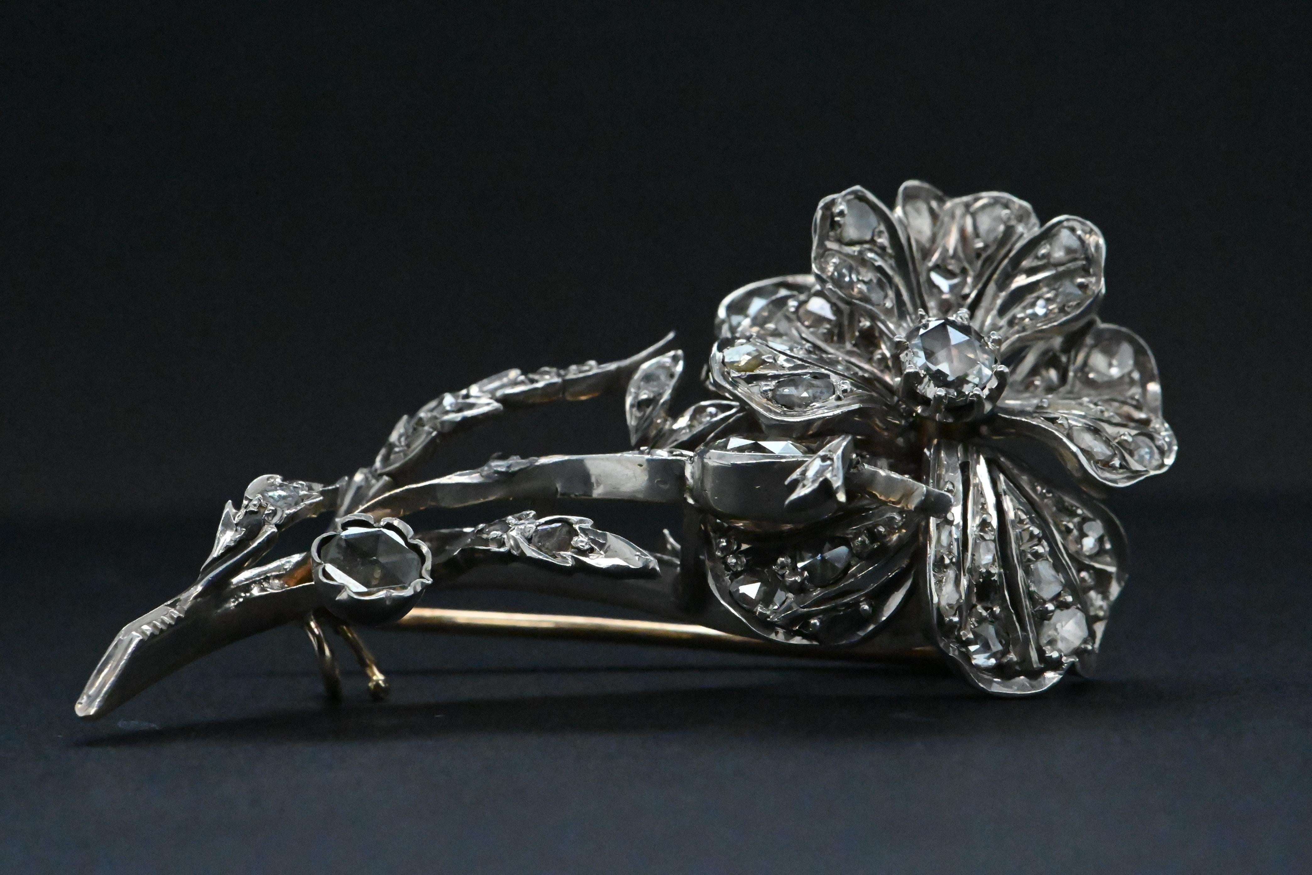 Artisan 18 Carat White Gold Flower Brooch Adorned With Diamonds For Sale