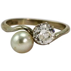Antique 18 Carat White Gold Natural Pearl and 1 Carat Diamond Crossover Moi et Toi Ring