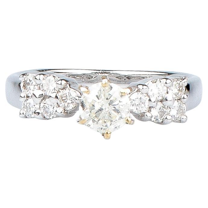18 carat white gold ring designed with round brillant cut diamonds For Sale