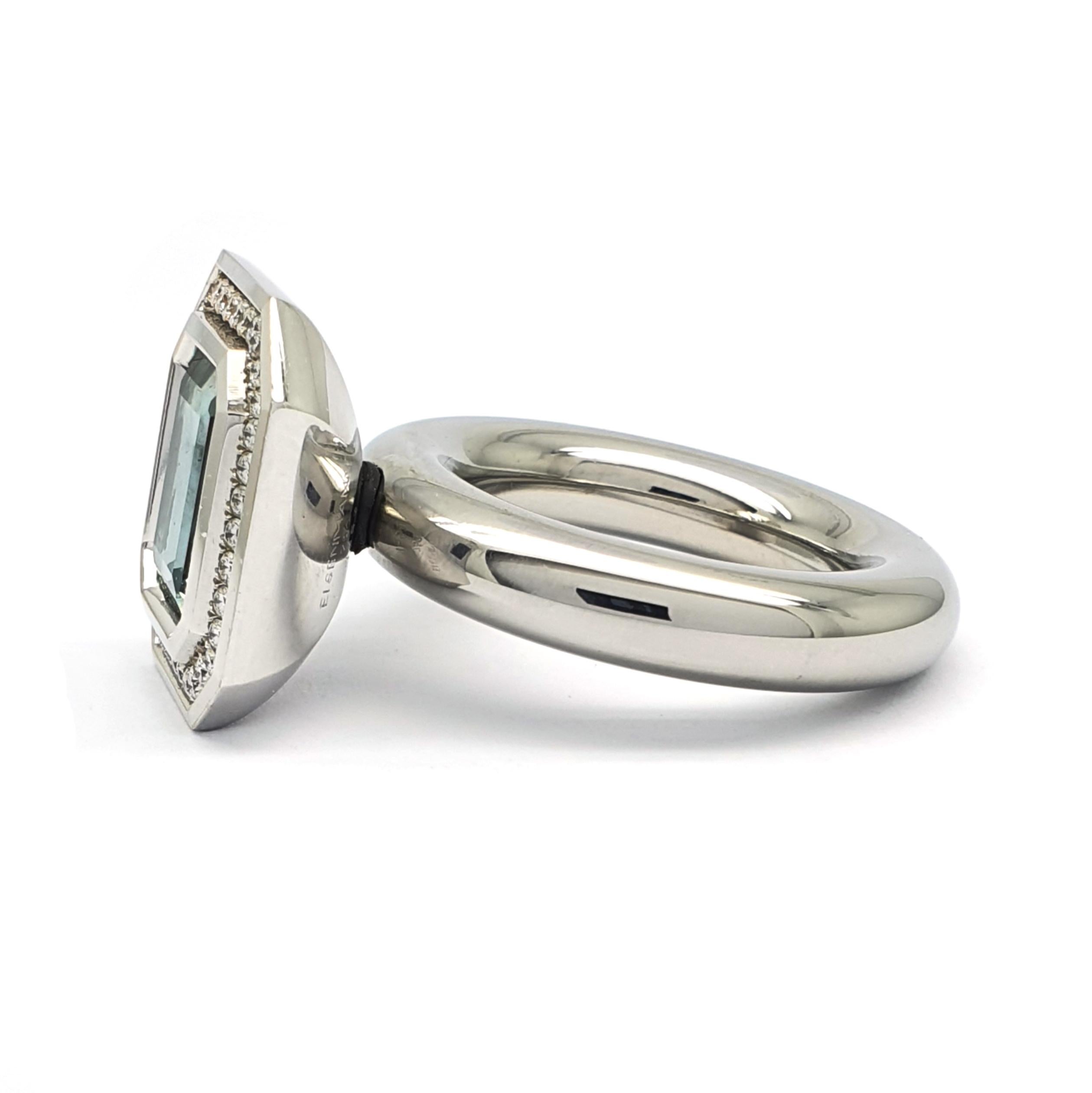 An 18 carat white gold Own Screw, typical Eigenmann Ring, occupied with an 8-angular emerald sharpened 4.14ct light blue Aquamarine with an entourage of 38 H&A cut diamonds 0.32ct. The diamond color is F and the clarity is VVS. White gold weight is