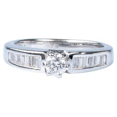 18 carat white gold round and baguette cut diamonds ring 