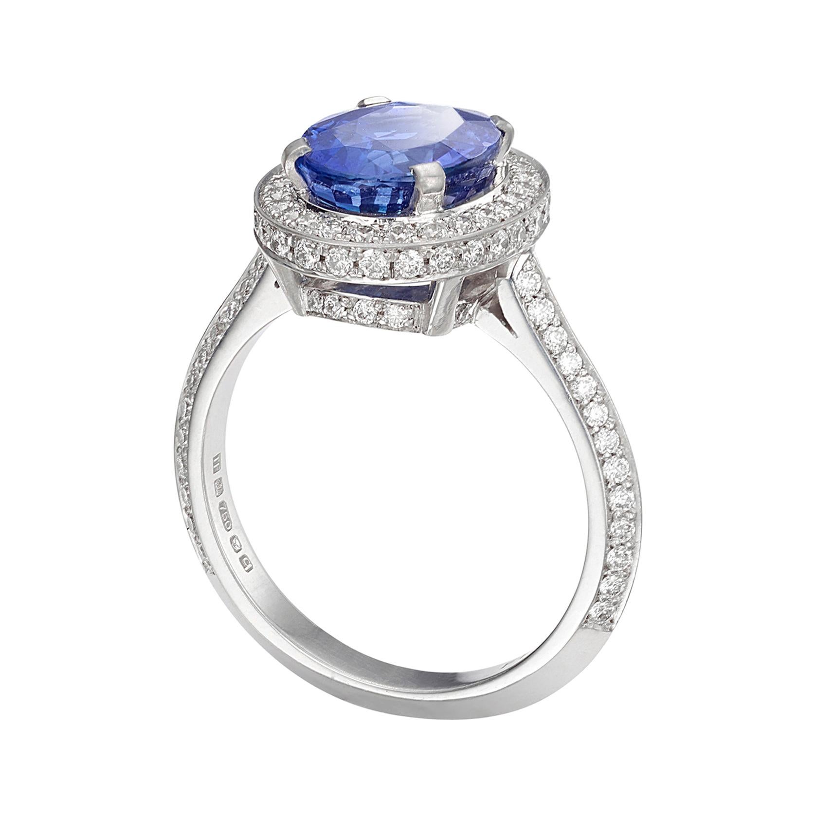 18 Carat White Gold, Sapphire and Diamond Halo Ring For Sale