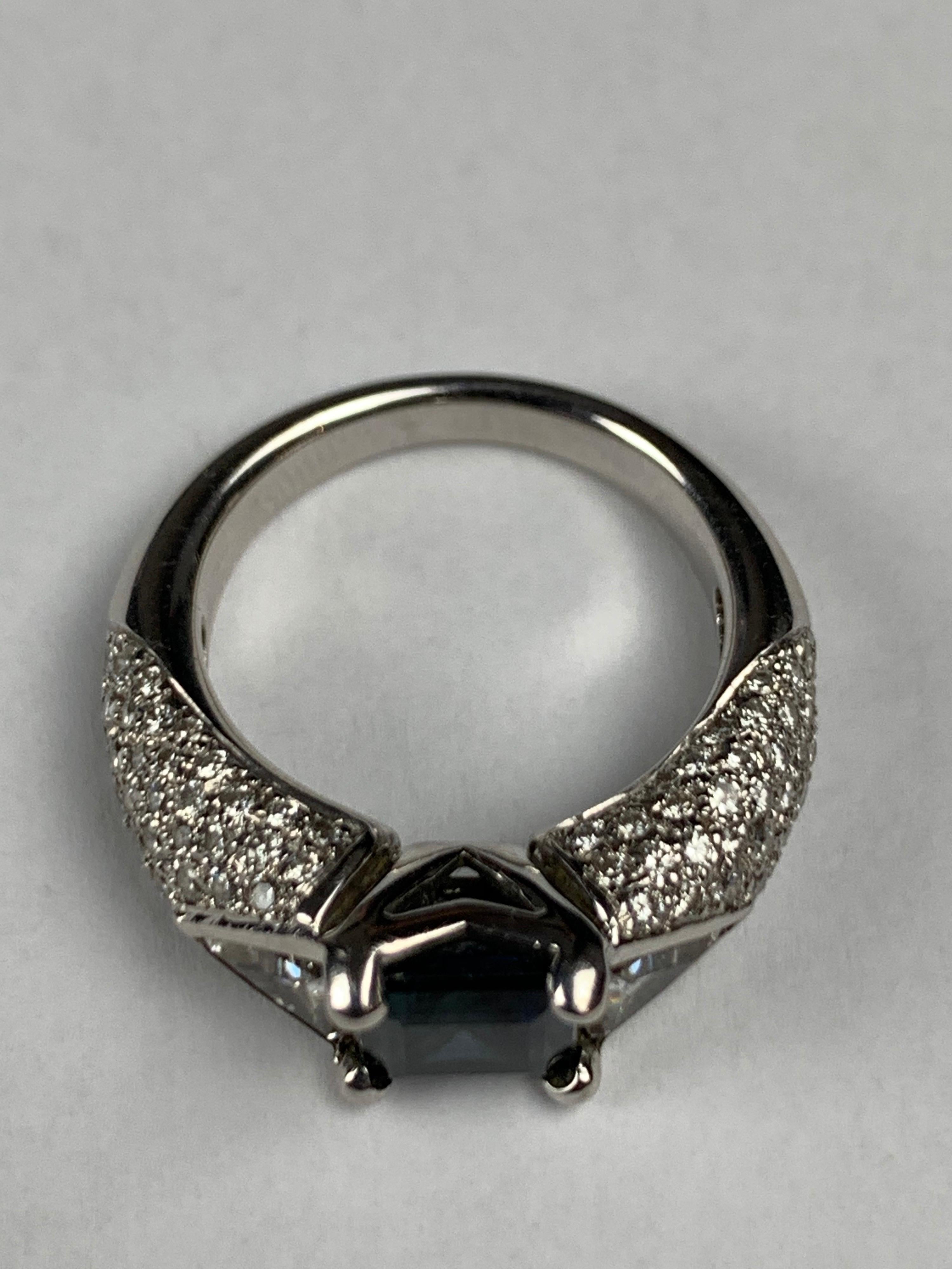 A Modern 18 Carat White Gold & Ceylon Sapphire 2 Carat Cocktail Ring With 2 Carat Diamond (G-S1)  Shoulders, Trilion Cuts And Pave Setting.
English Made.