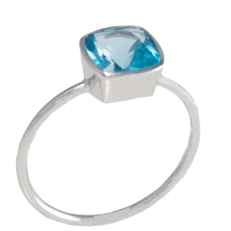 18 Carat White Gold Swiss Blue Topaz Ring. 

Esther Eyre has been designing and making precious jewellery for over twenty years. She trained at Kingston and Middlesex gaining a BA in jewellery design in 1982. Esther worked briefly in Mappin & Webb