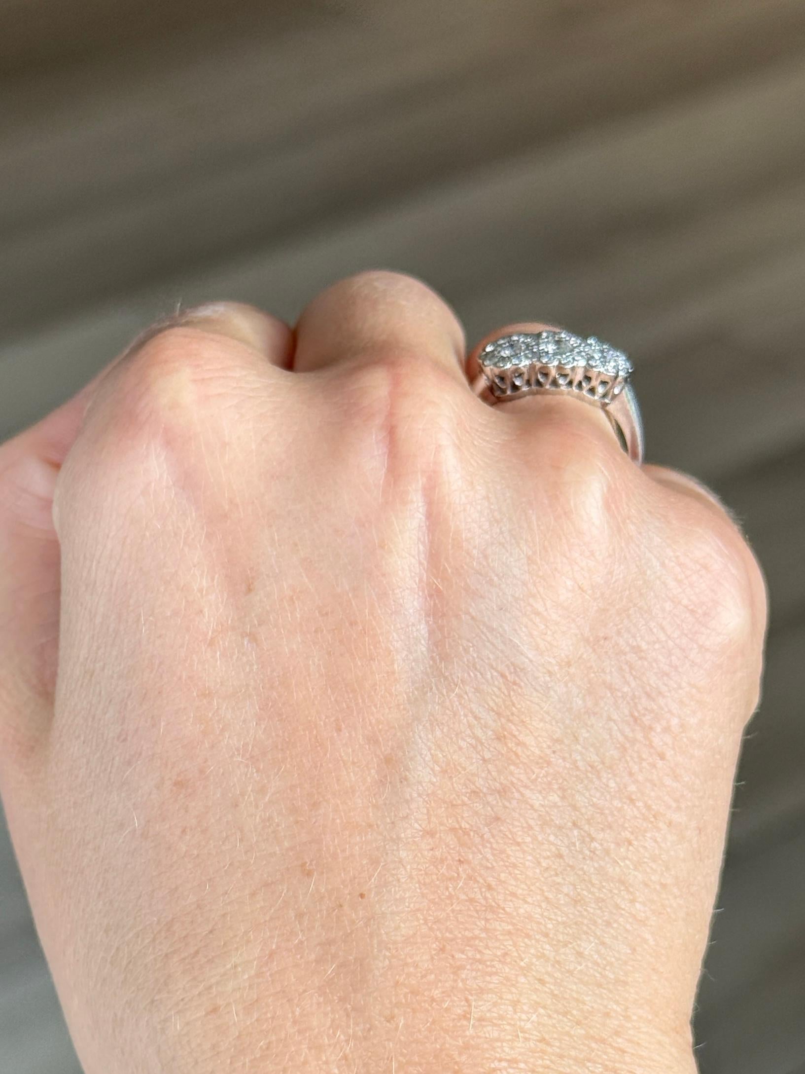 This gorgeous triple cluster is super sparkly. It holds a total of 94pts worth of diamonds. The ring is modelled in 18 carat white gold.

Ring Size: N or 6 3/4 
Cluster Dimensions: 8x16mm
Height Off Finger: 4mm

Weight: 5.4g