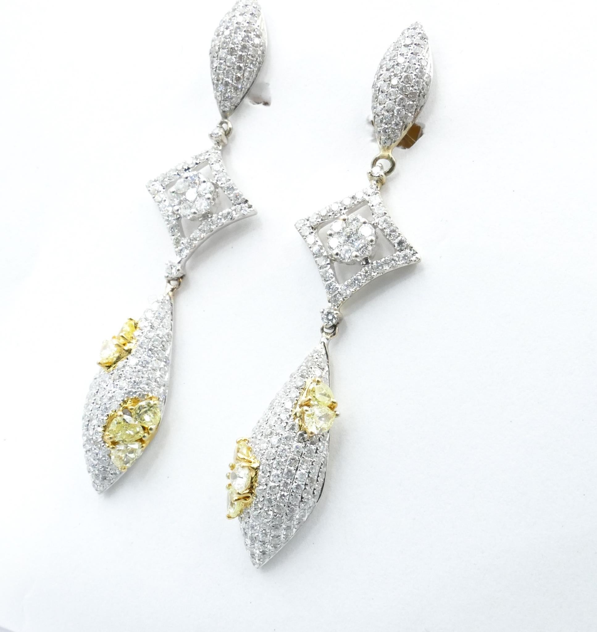 The Earrings have 10 Pear Shaped Yellow Diamonds totally 1.57 Carats, claw set & 386 Round Brilliant Cut White Diamonds, Colour F, Pave Set & totalling 4.19Carats.
Total Weight of Diamonds is an estimated 5.76 Carats
Total Weight of Earrings