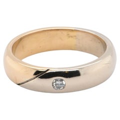 Alianza de boda para hombre en oro amarillo y blanco de 18 quilates con un diamante