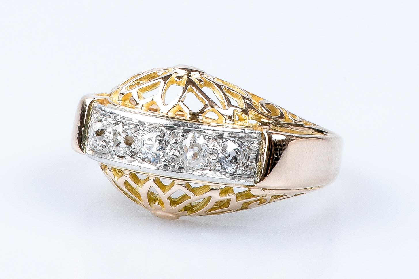 For Sale:  18 carat yellow and white gold ring designed with 5 round brillant cut diamonds 12