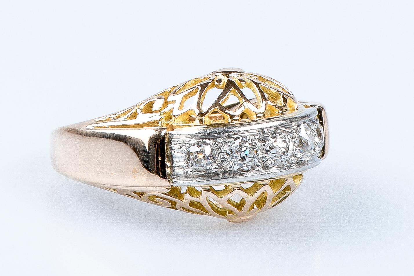 For Sale:  18 carat yellow and white gold ring designed with 5 round brillant cut diamonds 5