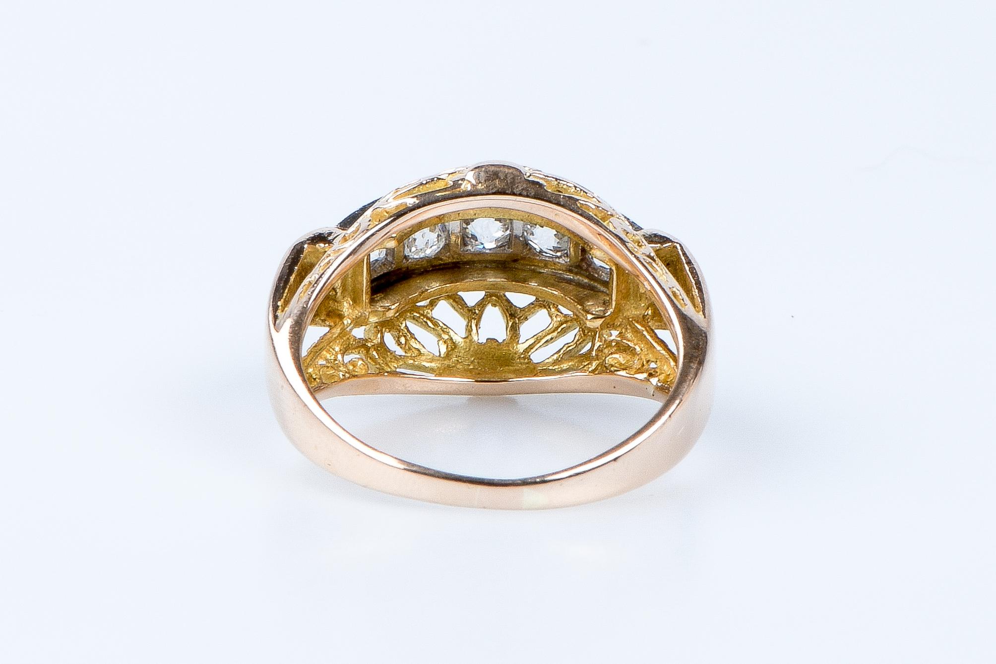 For Sale:  18 carat yellow and white gold ring designed with 5 round brillant cut diamonds 9