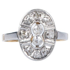 18 carat yellow and white gold ring designed with round brillant cut diamonds