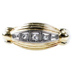 18 carat yellow and white gold ring designed with round brillant cut diamonds 