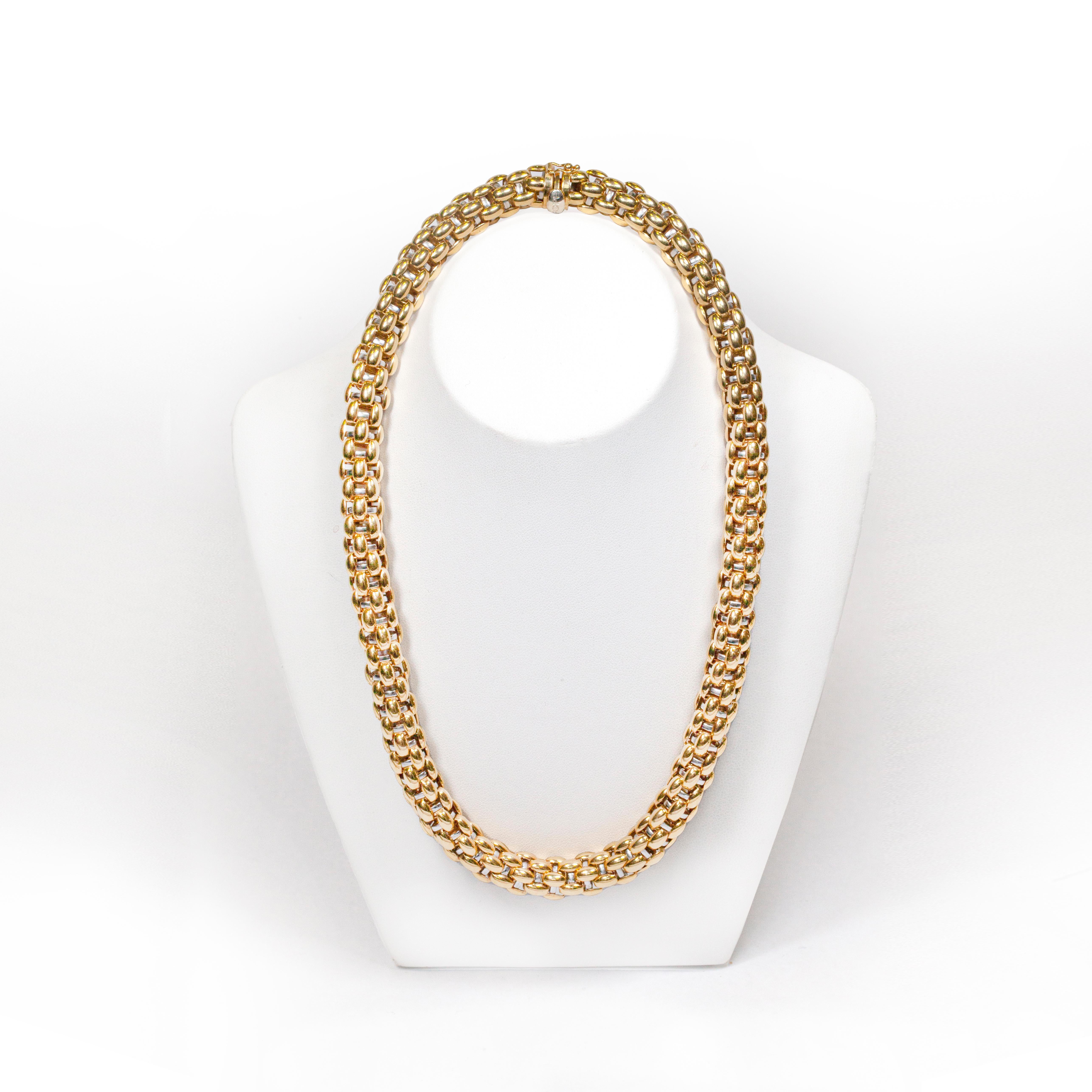 This striking yellow gold necklace from Fope feature's their signature Novecento mesh design with white gold woven into the piece. This incredible necklace elevates everyday outfits, and adds chic glamour on those special occasions.  Totalling 75.80