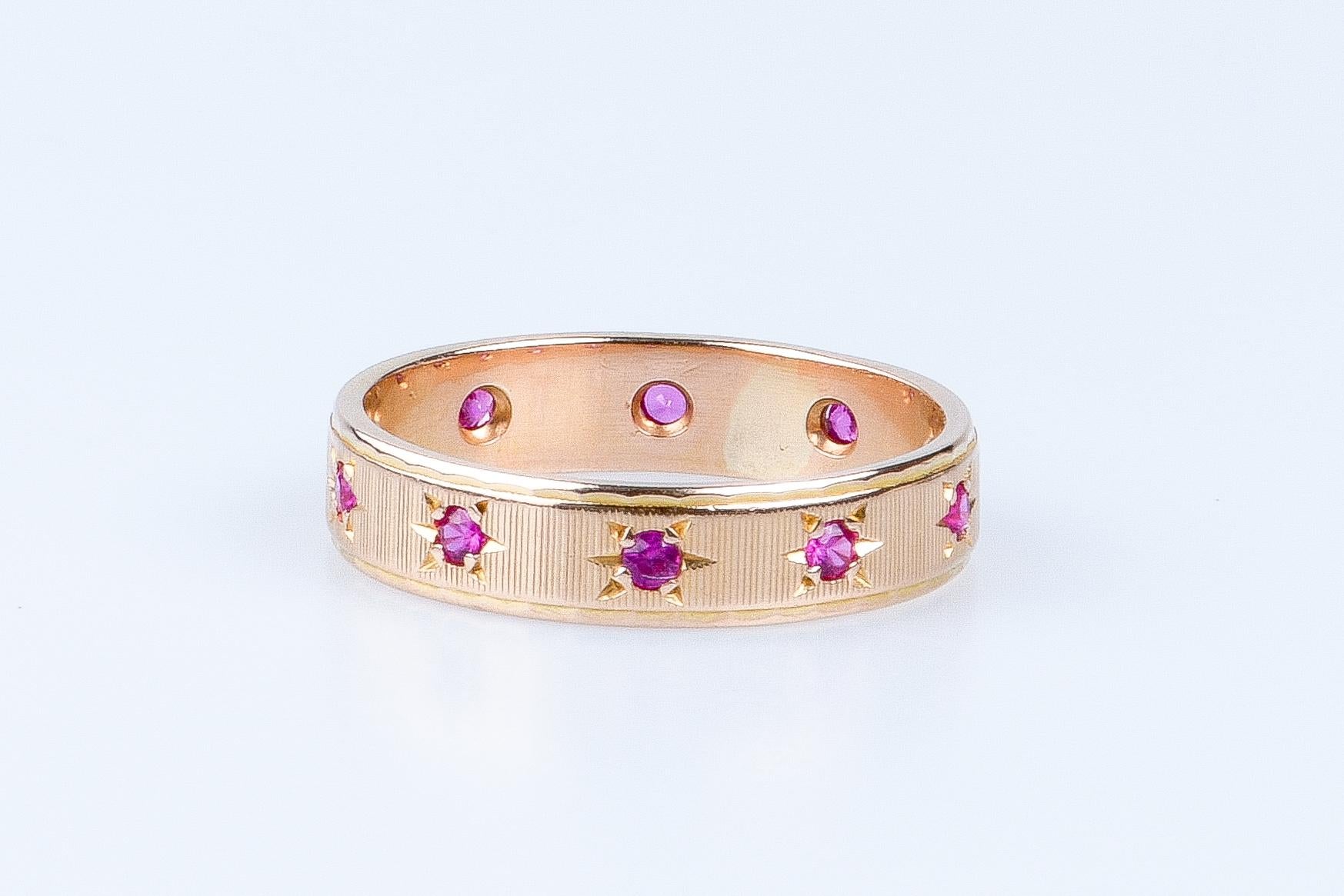 18 carat yellow gold alliance designed with 10 round rubies weighing 0.20 carat 1