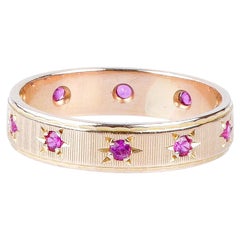 18 carat yellow gold alliance designed with 10 round rubies weighing 0.20 carat