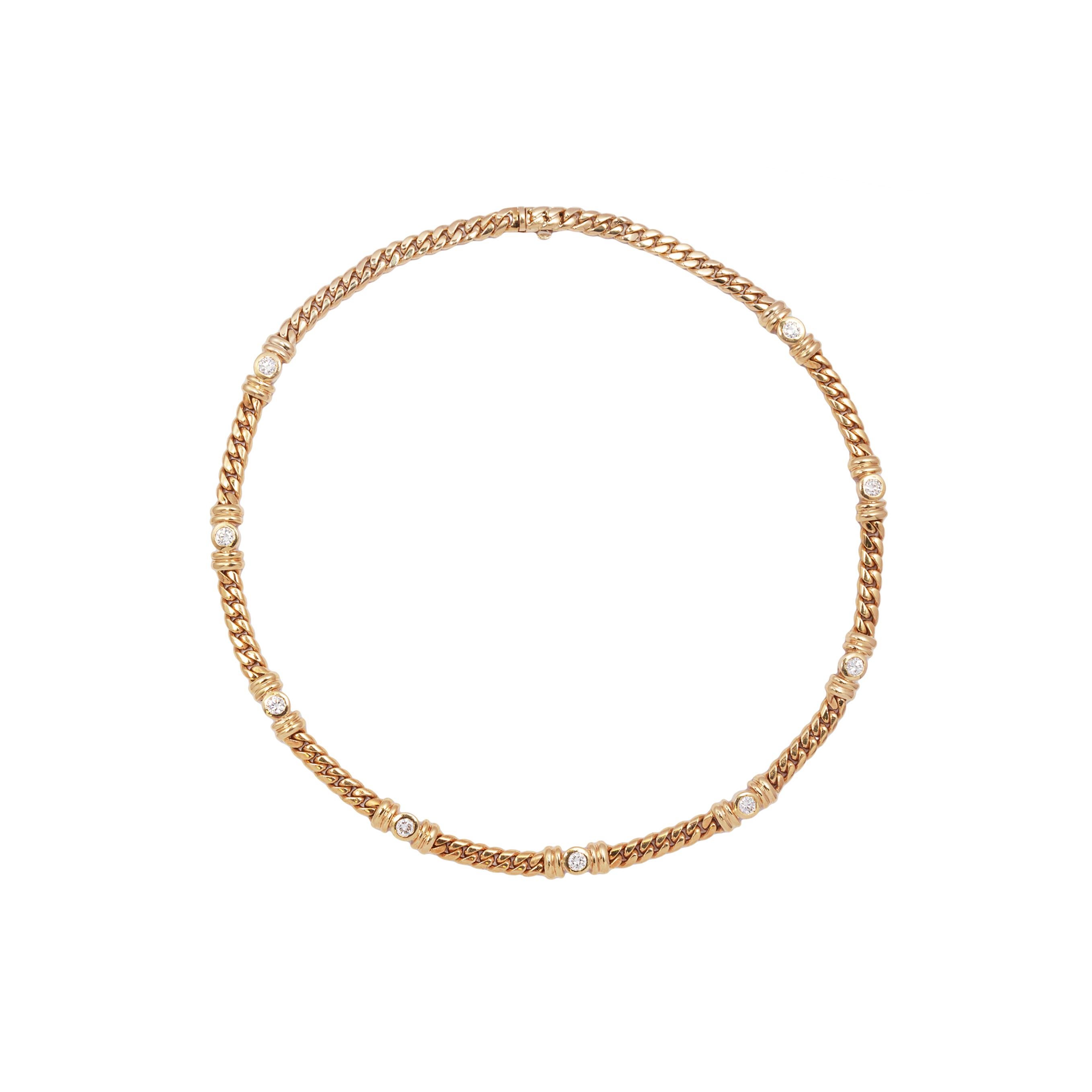 This 18 carat yellow gold necklace by Asprey is sublime.

Measuring 16 inches in length is this beautiful and substantial flat curb chain, but with an Asprey's design twist. It has been artfully rub-over set with nine round brilliant cut diamonds,