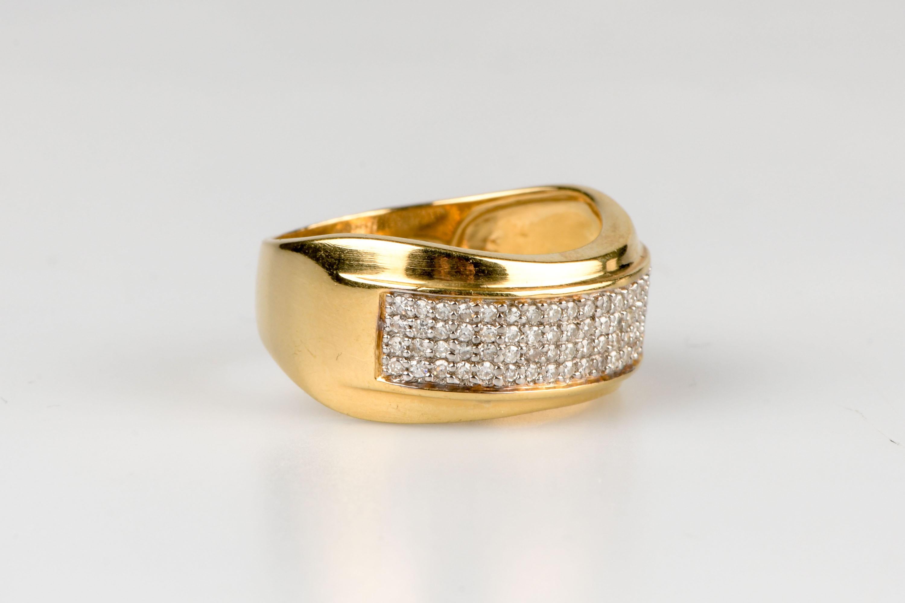 18 carat yellow gold ring designed with 80 round brilliant cut diamonds weighing 0.80 carat.               

Diamond quality
Color: H
Clarity: SI

Weight : 5.80 gr.

Size : EU : 52 - ES/IT : 12 - US : 6

Dimensions : 1.08 x 2.00 x 0.40 cm

Marked 18